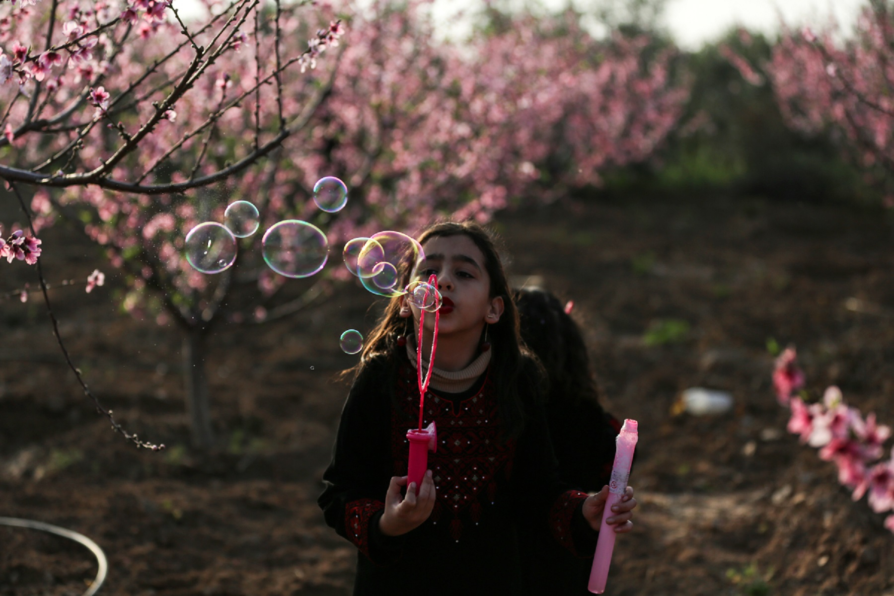 Girl blowing bubbles